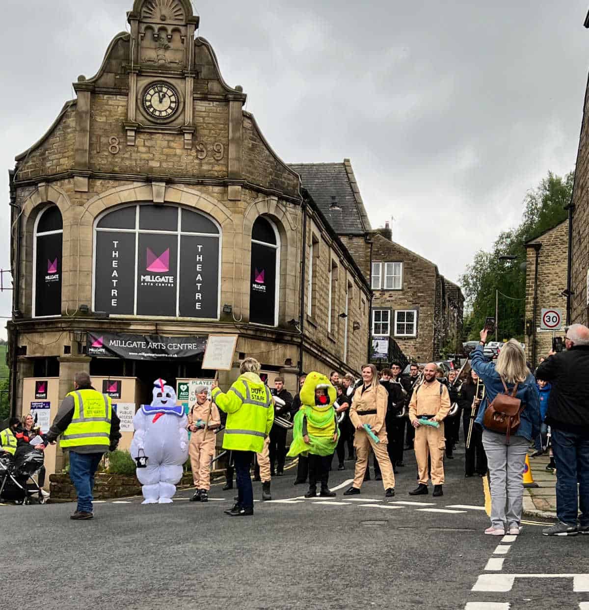 novelty brass band dressed as Ghostbusters about to start their street march in Delph 2024
